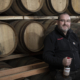 Benromach Distillery Manager Keith Cruickshank in Dunnage Warehouse with whisky casks