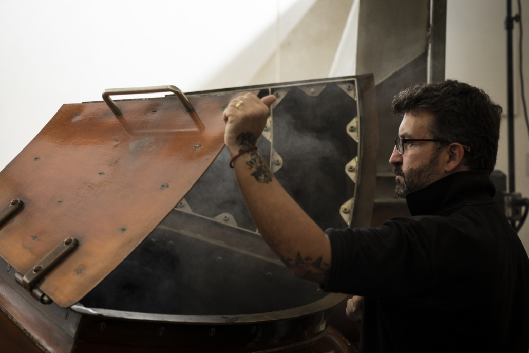 Benromach distillery - Brian operates the mash tun with cloudy wort